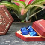 Elderwood RPG dice in a wooden dice box