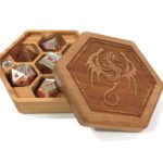 Our Hex Chest dice box in cherry hardwood with alloy metal dice