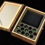 Interior of Cthulhu Spellbook gaming box with foam insert holding gemstone dice