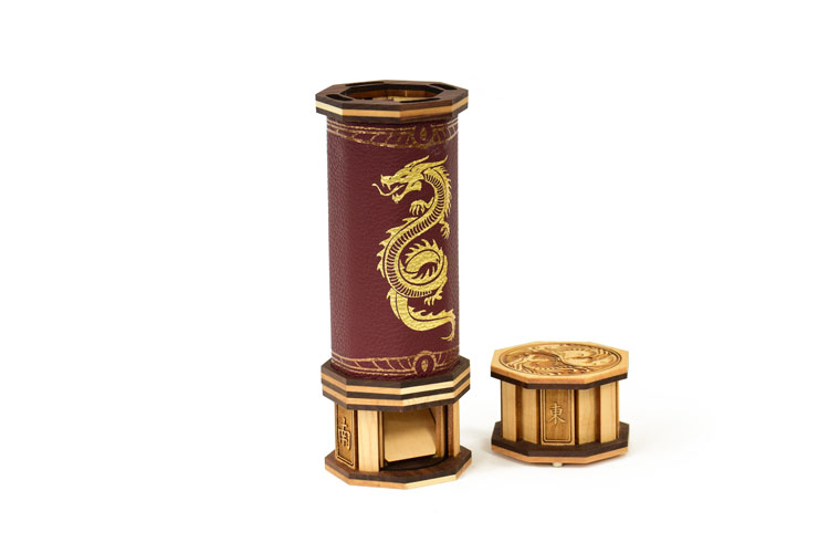 Red leather codex dice tower with engraved maple and walnut caps and a gold foil pressed serpent for rolling dice