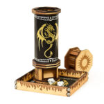 Black leather codex dice tower with engraved maple and walnut caps and a gold foil pressed dragon for rolling dice