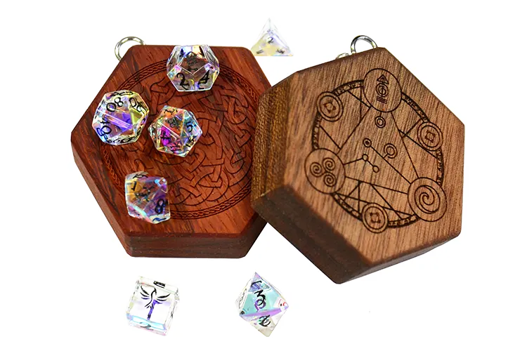 Padauk and Mahogany wood Mini Hex Chest dice box with engravings and rainbow crystal mini polyhedral dice for tabletop gaming