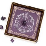 Purple leather and wood Scroll rolling tray with a silver Spellcircle foil pressing and purple amethyst dice for dungeons and dragons