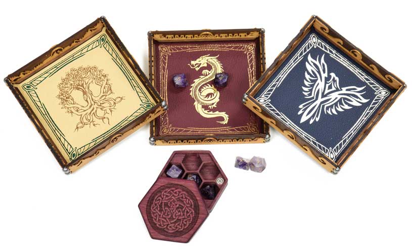 A trio of yellow, red, and blue dice rolling trays with dice and a hex chest