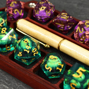 Red padauk rupee hex chest dice box with sharp-edge acrylic dice and a pen, showing that modern sharp-edged dice fit into the dice box's pockets